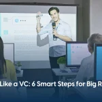 Man on the stage with a mic - Pitch Like a Venture Capitalist in 6 Simple Steps